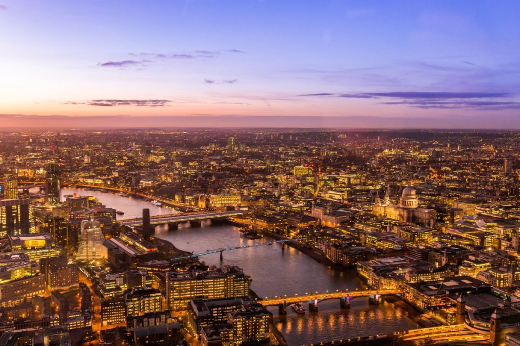 What are the benefits of a riverside venue? 4 a city with lights and a river