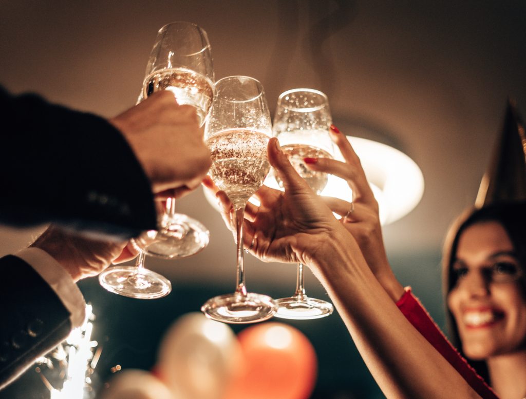 Social Events 2 a group of people clinking wine glasses